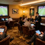 8xbet enthusiasts placing bets in a vibrant sports betting lounge during live events.